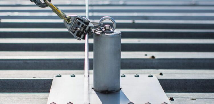 Industrial rooftop fall protection system with anchors, guardrails, and ladder access in Ontario commercial facility