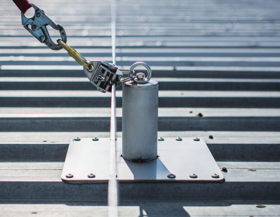 Industrial rooftop fall protection system with anchors, guardrails, and ladder access in Ontario commercial facility