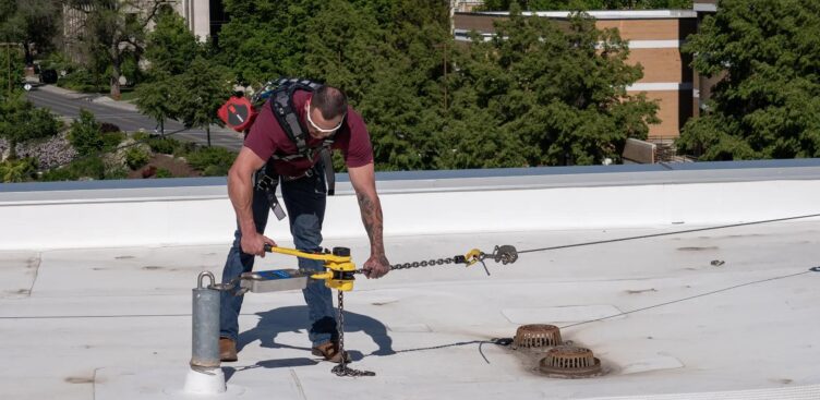 Roof anchor fall protection system installed on industrial rooftop in Ontario for safety and compliance inspections