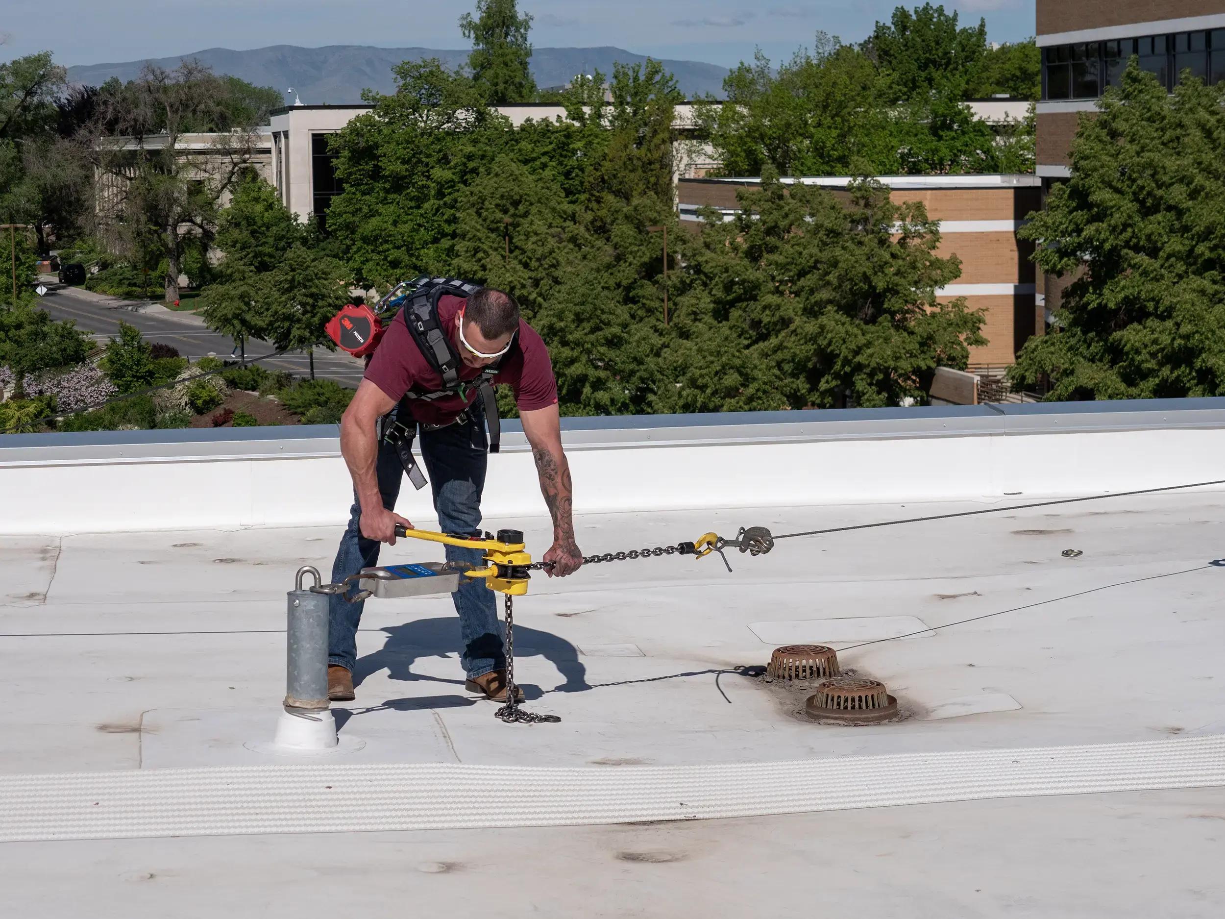 Roof anchor fall protection system installed on industrial rooftop in Ontario for safety and compliance inspections